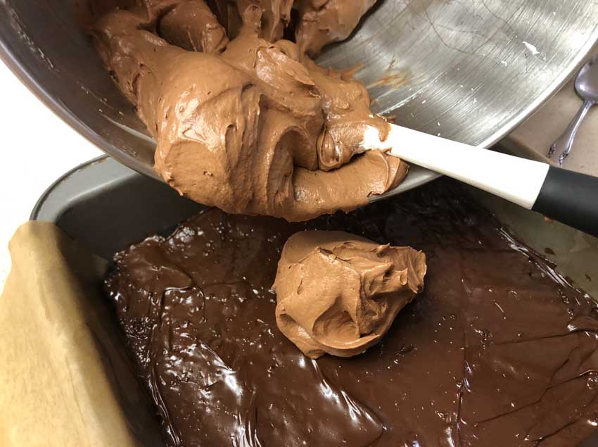 Fold the melted chocolate into the whipped toping.